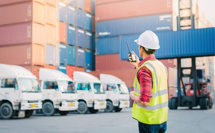 Asian foreman control loading Containers box for Logistic Import Export in dock